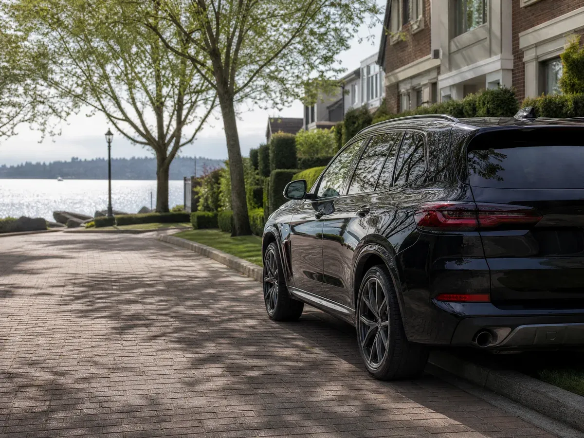 Residential street in Kirkland, WA with a vehicle parked in the driveway